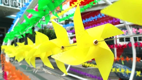 yellow windmill toy is decorated at shopping mall to welcome summer1 photo