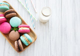 Colorful macaroons and milk