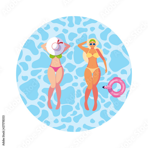 beautiful girls couple with swimsuits floating in water
