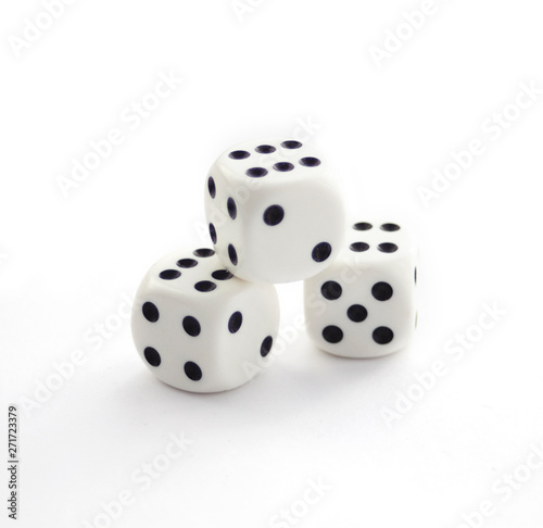 Three white plastic dices isolated on white
