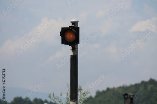Red traffic light on the road in night city. dangerous signal stop crash driving highway,expressway; Blurred background of car dark fast truck surveillance security with semaphore. safety street 
