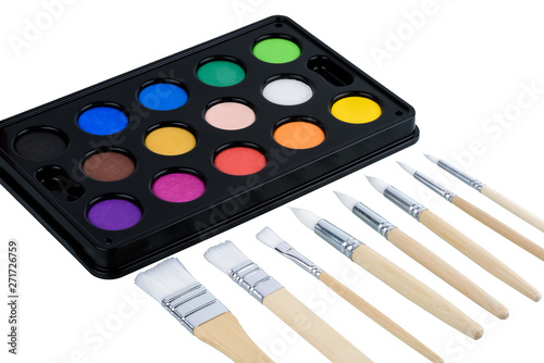 watercolor paint set and paintbrush isolated on white background