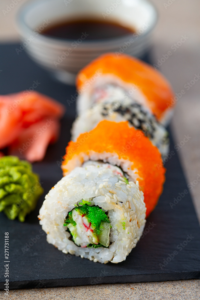 sushi rolls on black stone plate sushi rolls on black stone plate