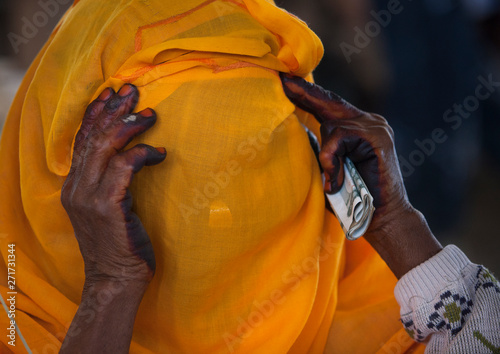 Woman hiding her face, Adi keyh, Eritrea photo