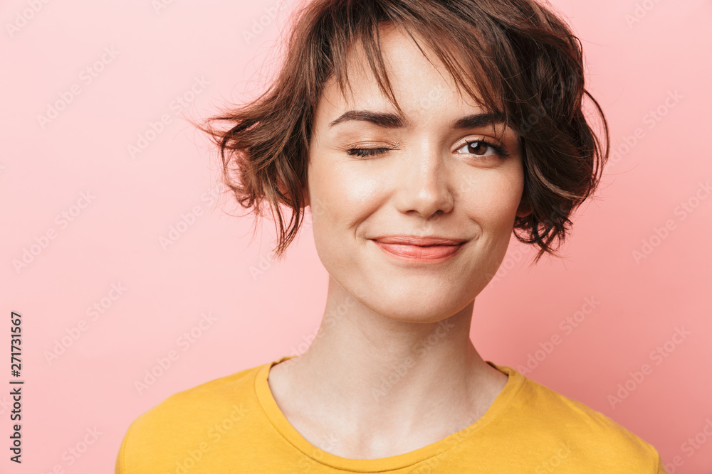 Happy beautiful woman posing isolated over pink wall background. Happy beautiful woman posing isolated over pink wall background.