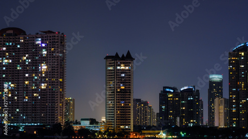 Business architecture, skyscrapers and light trails, Close shot of skyscrapers with lights, Night building. © suriyapong
