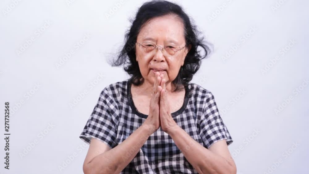 Asian senior woman show Thailand's greeting style Asian senior woman show Thailand's greeting style