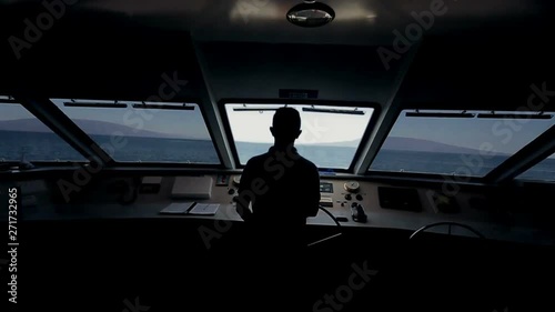 Captain on deck of large ship