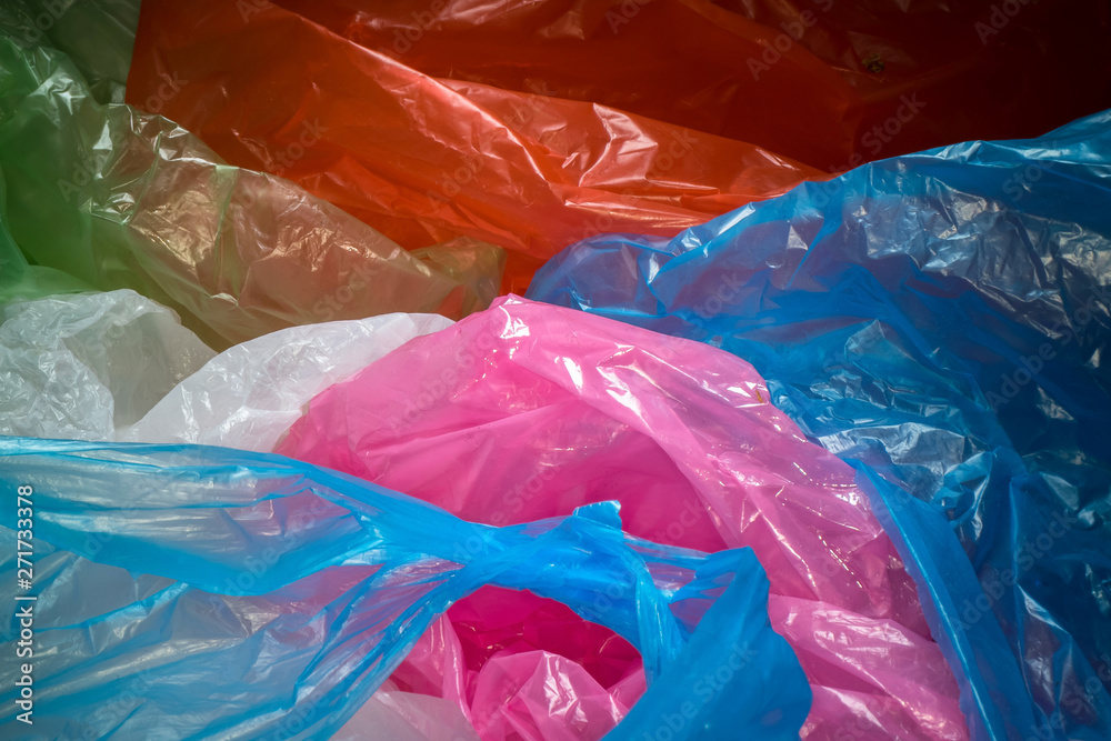 Fototapeta premium Disposable plastic bags background. Lightweight transparent, reusable plastic waste. Rubbish bags, plastic recycling, environmental issues