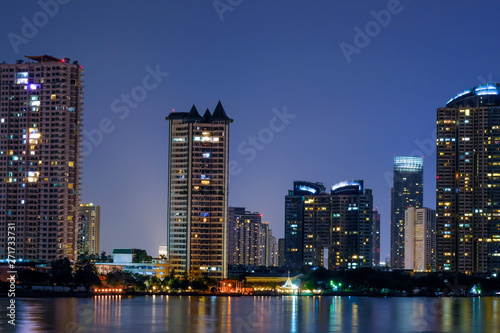 Business architecture, skyscrapers and light trails, Close shot of skyscrapers with lights, Night building. © suriyapong