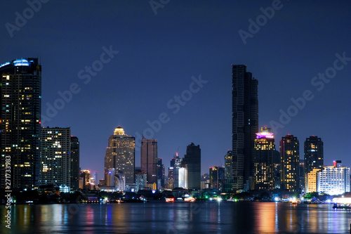 Business architecture, skyscrapers and light trails, Close shot of skyscrapers with lights, Night building. © suriyapong