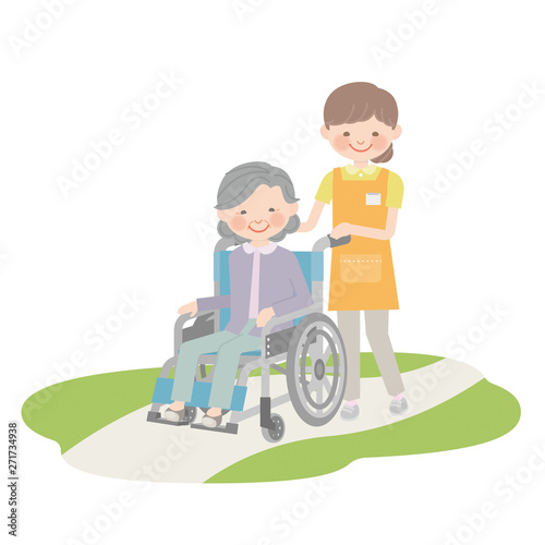 介護士に車椅子を引いてもらうおばあゃん