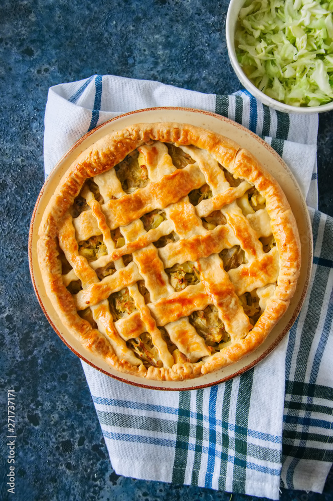 Top view of homemade young cabbage pie. Top view of homemade young cabbage pie.