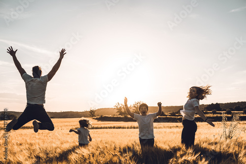Happy and fun family in nature. Concept of united family having fun and smiling