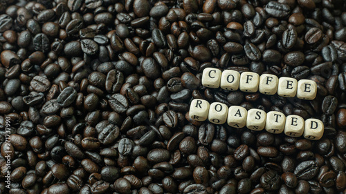 The coffee roasted and text wood cube close up image.