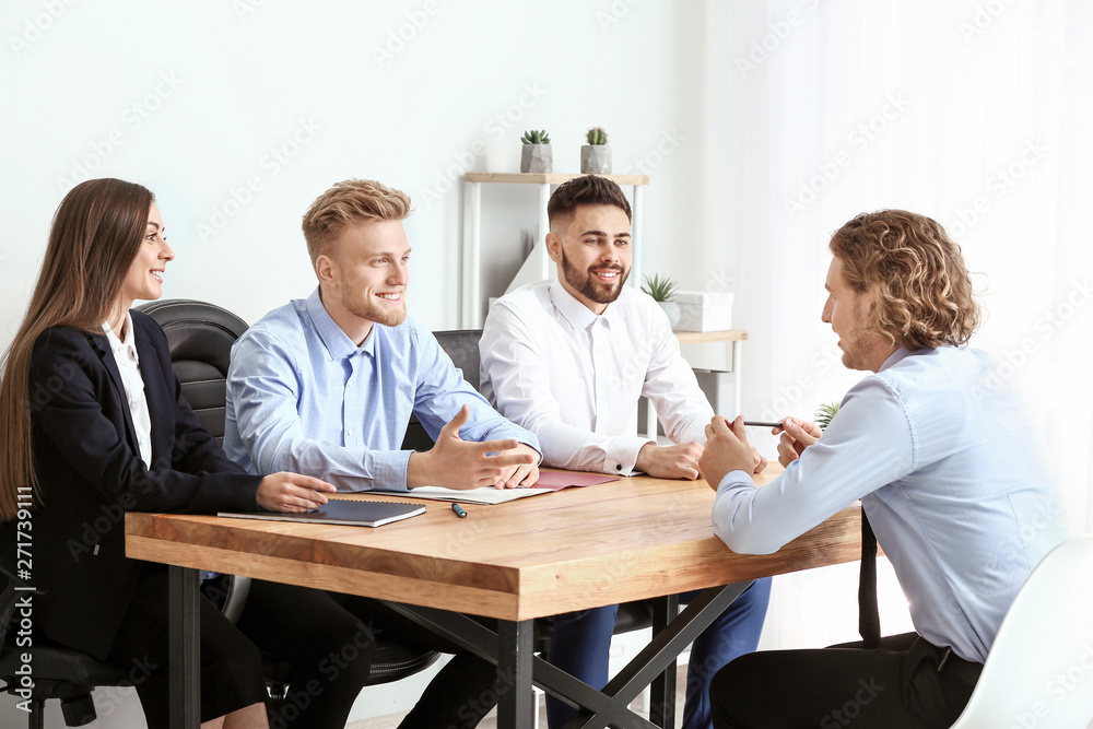 Human resources commission interviewing man in office Human resources commission interviewing man in office