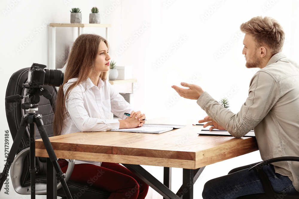 Human resources manager interviewing man in office Human resources manager interviewing man in office
