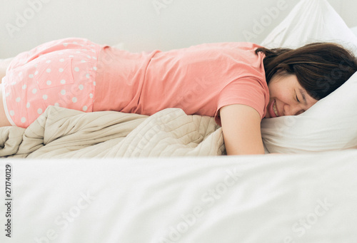 Asian women sleeping on the bed and grinding teeth,Female tiredness and stress