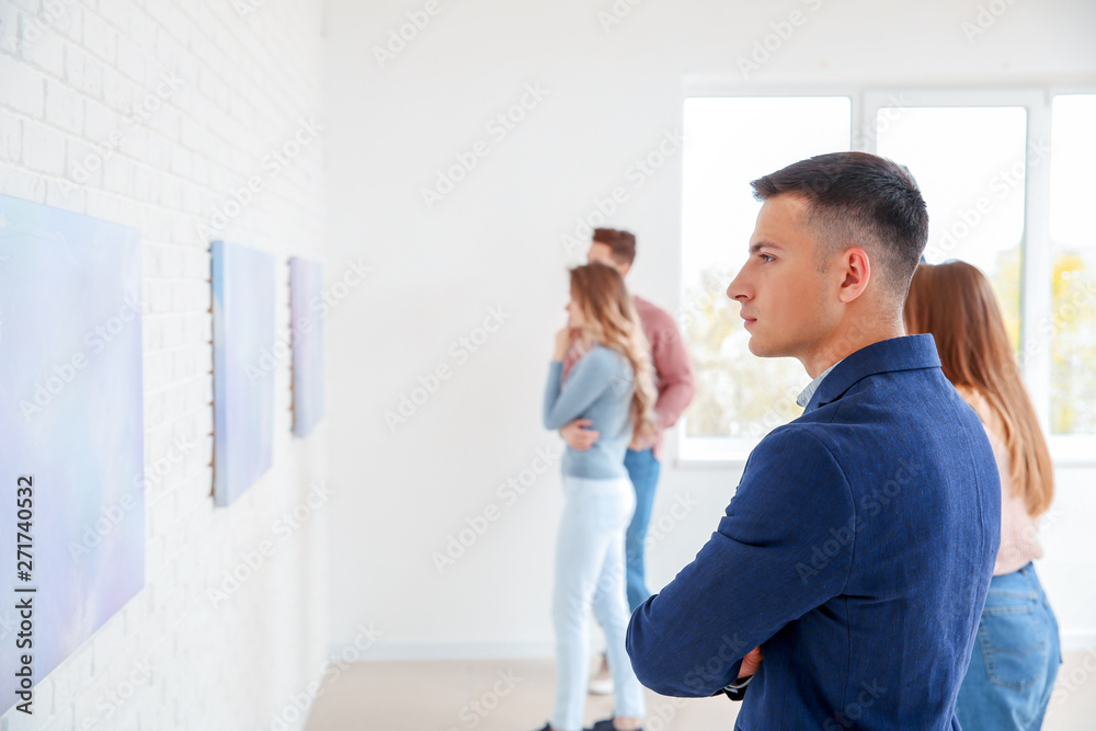 Fototapeta premium People at exhibition in modern art gallery