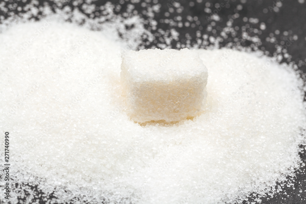 Group of refined white sugar cubes close up