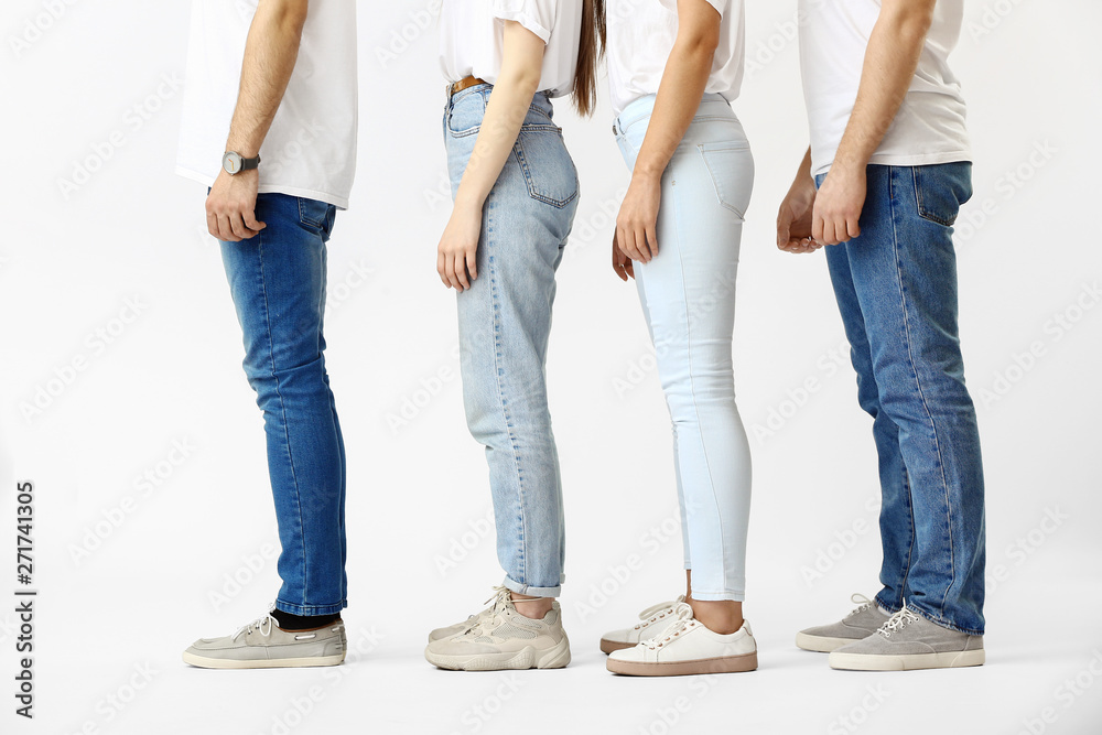 Stylish young people in jeans on white background Stylish young people in jeans on white background