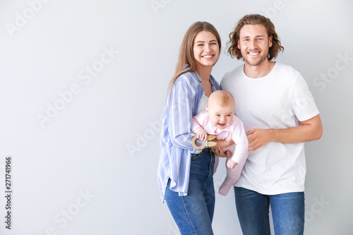 Happy parents with cute lit...