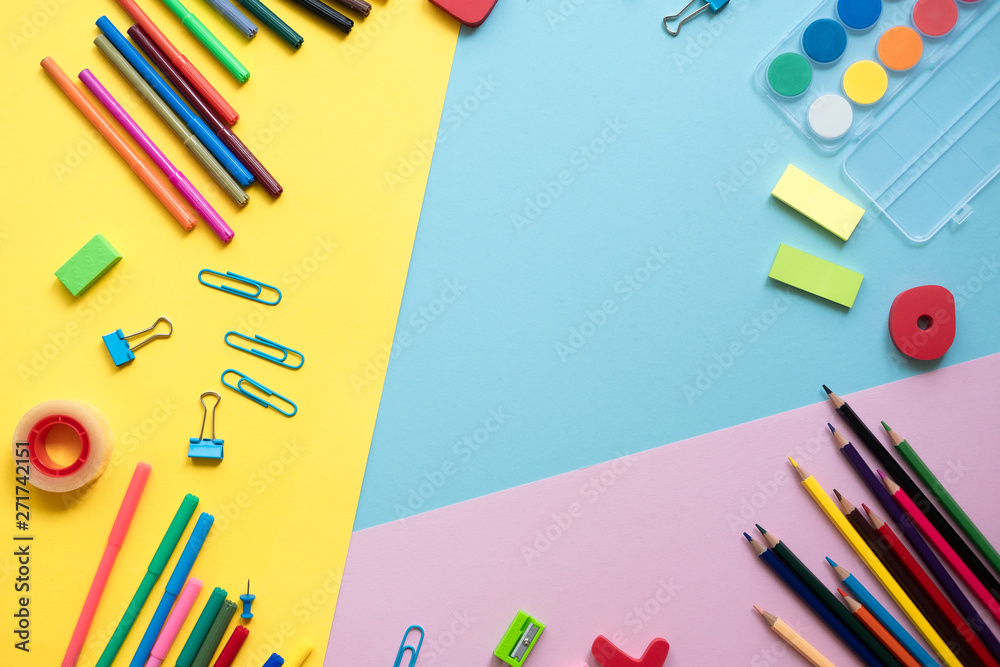 Fototapeta premium School supplies lay on color background, back to school concept, copy space