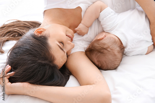 Happy mother with cute litt...