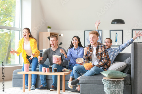 Friends watching sports on ...