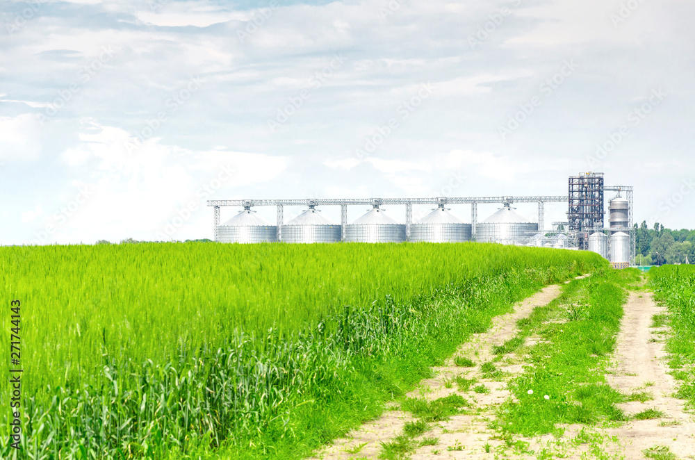 Metal modern elevator in the field of wheat Metal modern elevator in the field of wheat