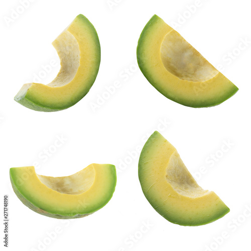 set of slices of avocado isolated on white background