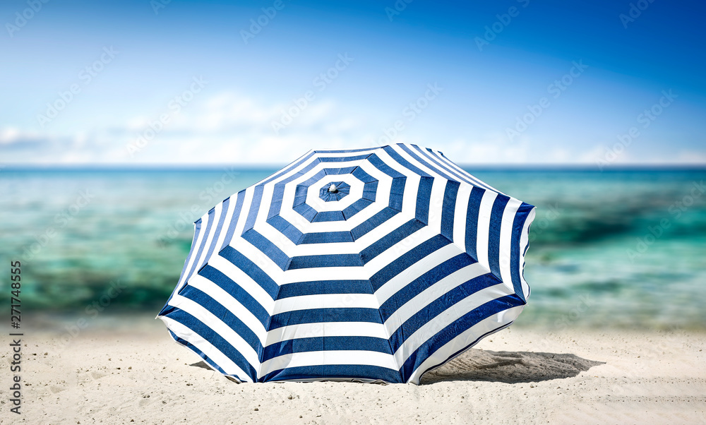 Summer umbrella on beach and free space for your decoration. 