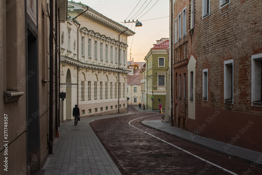 Narrow street in the Old Town of Vilnius at sunrise. Lithuania