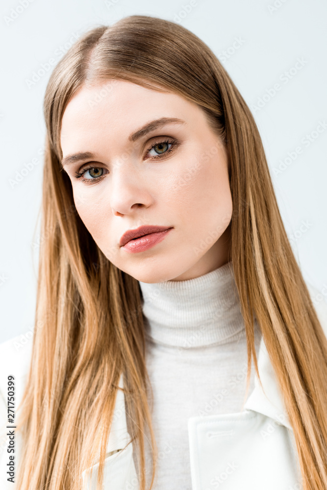 Naklejka premium beautiful blonde young woman looking at camera isolated on white