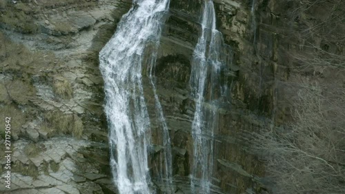 Aerial view of water falling from high waterfall photo