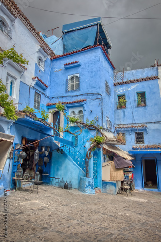 Detail of one of the beautiful streets of Chechaouen, in Morocco, with its traditional blue facades photo