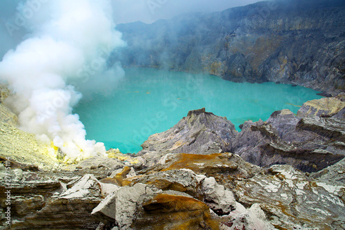SMOKE OF SULFUR ON KAWAH IJEN VOLCANO IN JAVA ISLAND-INDONESIA