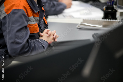 Engineering works with the tablet in the production control room.Control room of a steam Turbine,Generators of the coal-fired power plant for monitor process, business and industry concept