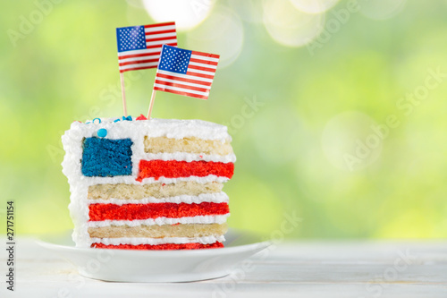 American national holidays concept - 4th of July, Memorial Day, Labour Day. Layered spounge cake in USA flag colours, rustic background, copy space photo