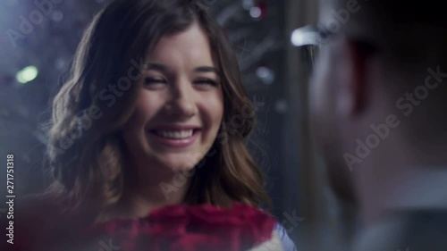 Man giving flowers to a young girl