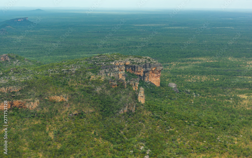 Light aircraft flying over rough terrain Kakadu National Park Northern Territory Australia