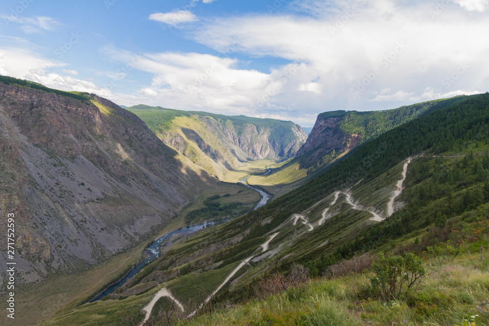 Valley of the river, top view. Altay mountains. Summer sunny day. Mountain car pass