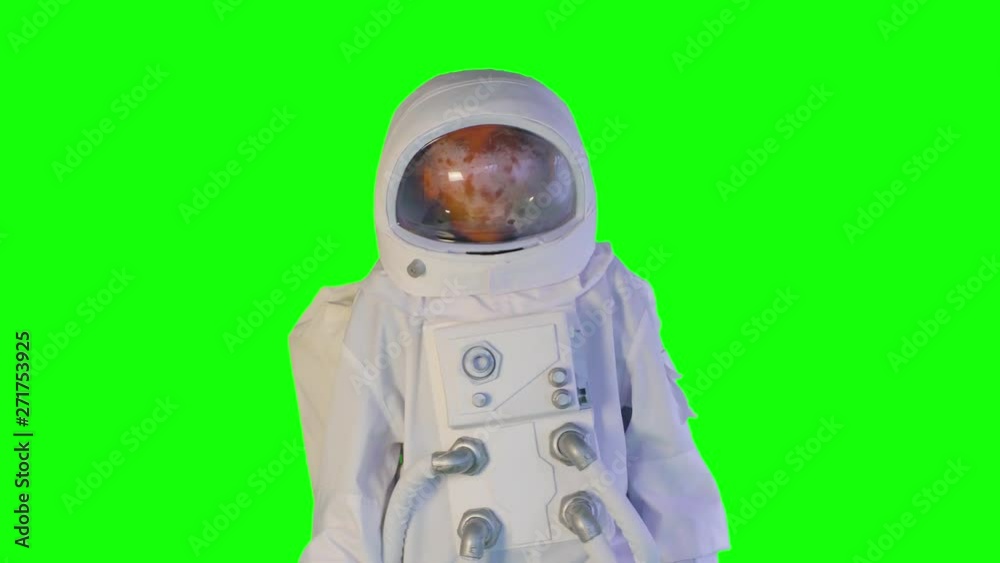 the astronaut goes forward on a green background the astronaut goes forward on a green background