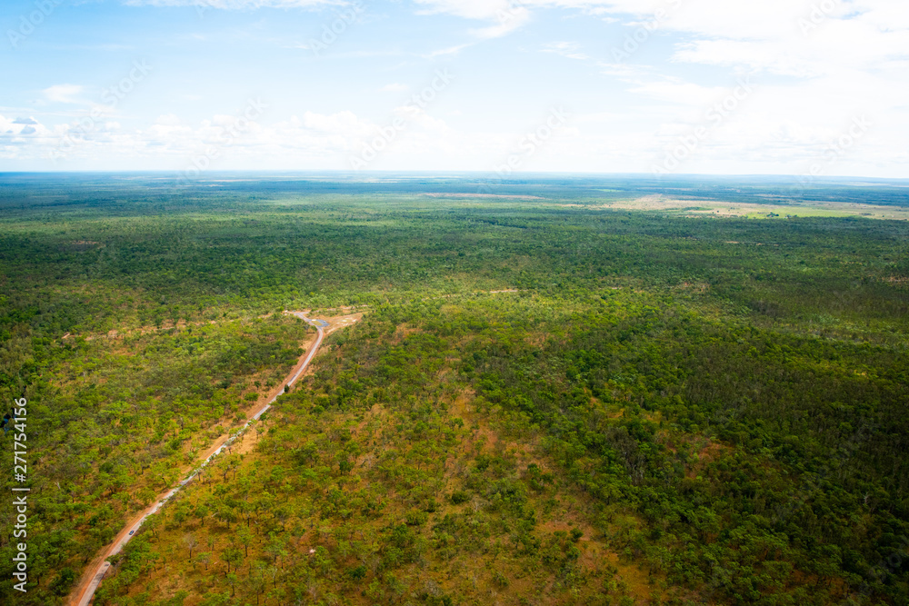 POV from light aircraft flying over Kakadu National Park showing rugged landscape