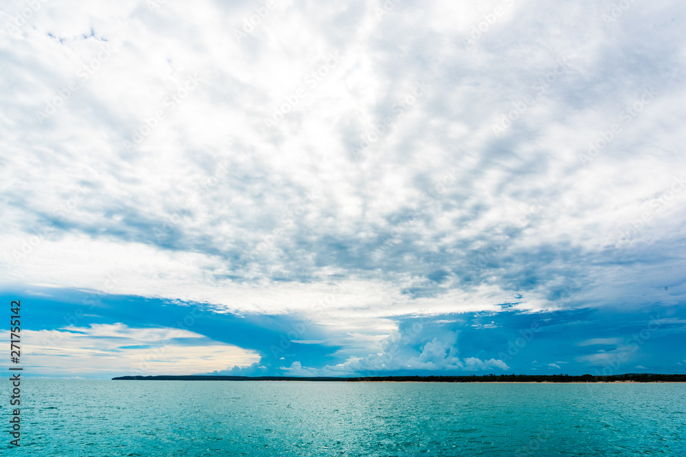 Storm clouds over island on horizon Darwin Australia