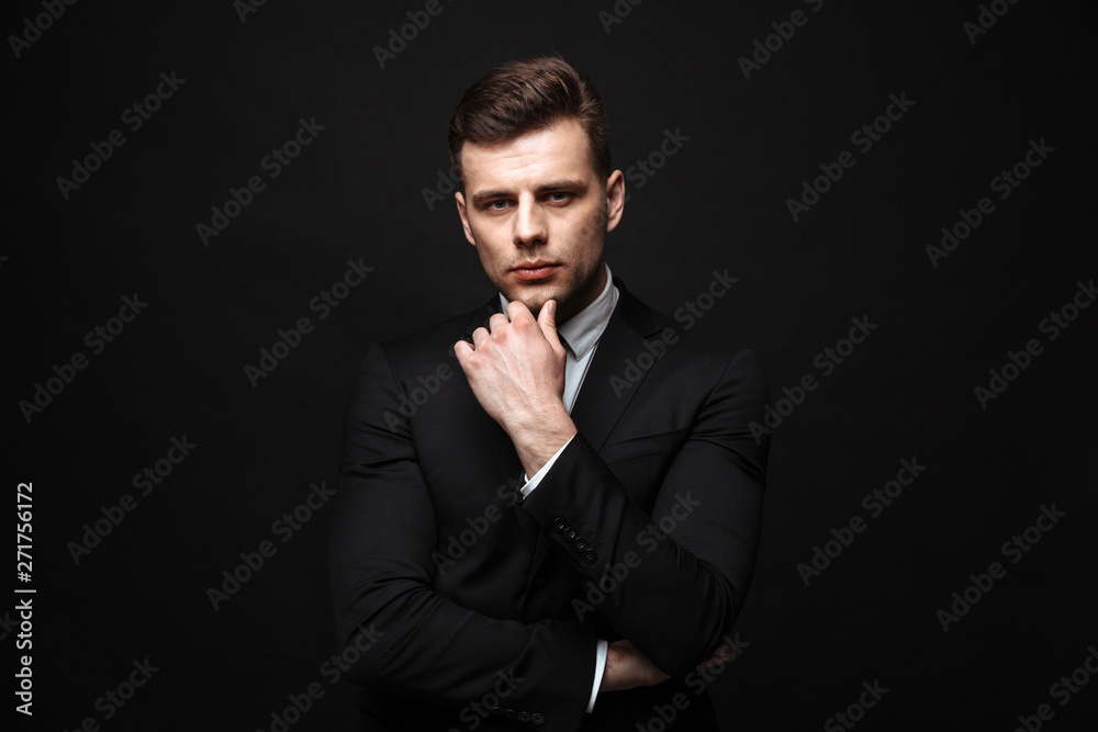 Fototapeta premium Handsome confident businessman wearing suit