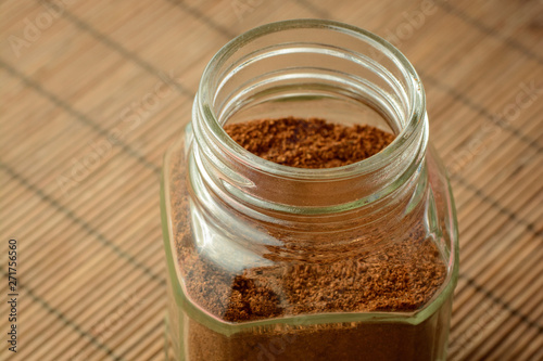 Jar of instant coffee on table