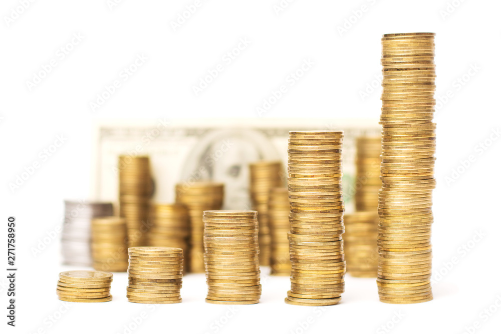 Piles of golden coins showing upward direction with many coins and one hundred US dollar banknote behind, isolated on a white background. Piles of golden coins showing upward direction with many coins and one hundred US dollar banknote behind, isolated on a white background.