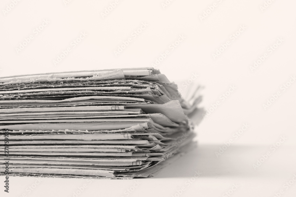 Black and white photo of newspapers on white background Black and white photo of newspapers on white background