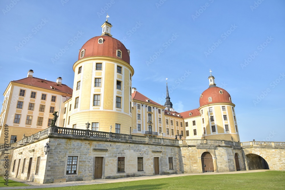 The beautiful medieval castle of Moritzburg in the early morning in Germany. Moritzburg Baroque palace with yellow walls and a red roof. Traveling concept background. Moritzburg built in 16tn century 